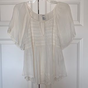 This is a beautiful sheer shirt perfect for summer and It’s a loose fit.